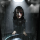 Elizabeth sees herself in the mirror in BioShock Infinite: Burial At Sea.